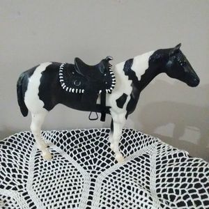 Paint Breyer horse with saddle